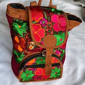 Embroidered Mexican floral design canvas backpack.